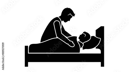 Mother tenderly holding and caring for her newborn baby in bed.