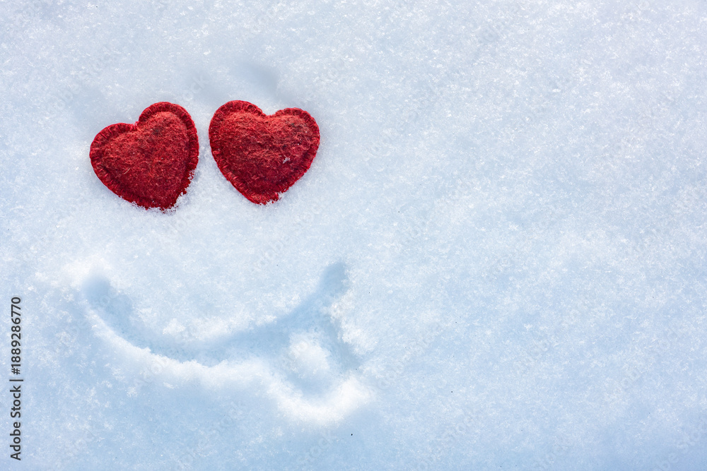 Fototapeta premium Valentine's Day, fun snow smiley, heart eyes on white snow background