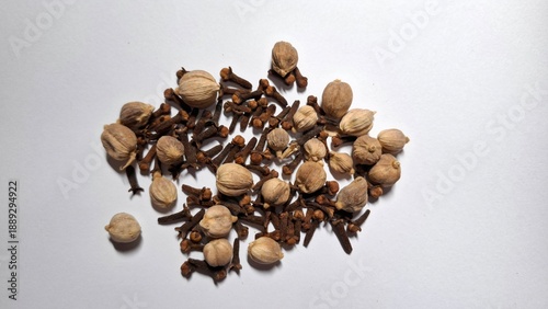 Cardamom and Cloves Spices Isolated on White Background