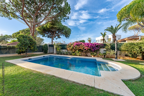 an image poolside at a luxury private swimming pool in mediterranean garden