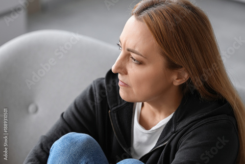 Angry mature woman at home,...