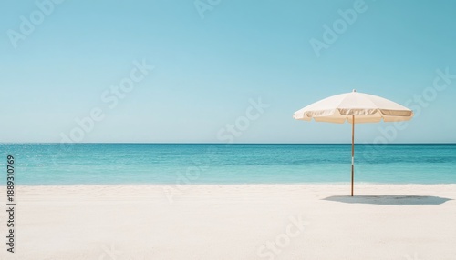 Enjoy serene beach views under a large umbrella on pristine white sand with gentle waves and clear blue skies
