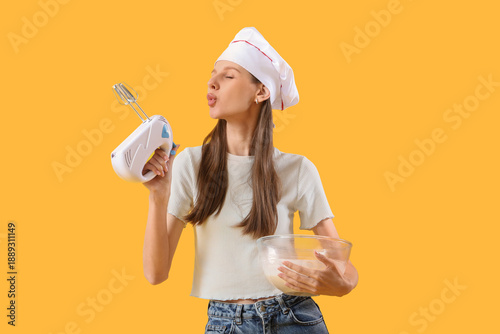 Female chef with mixer and ...