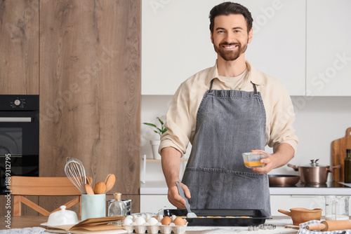 Young man preparing cookies...