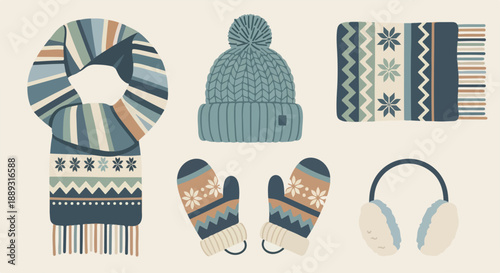 A flat lay of winter clothing and accessories including a scarf, hat, mittens, earmuffs, and a sweater on a beige background with a cold and cozy mood.