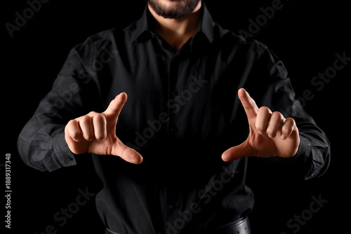 Businessman showing somethi...