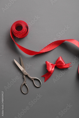 Red ribbon with scissors an...