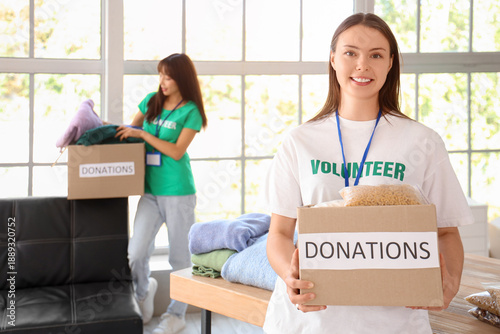 Young female volunteer with...
