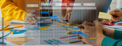 Foto Engaging image of a team collaborating on project management, showcasing a Gantt chart and colorful planning visuals in a modern office environment