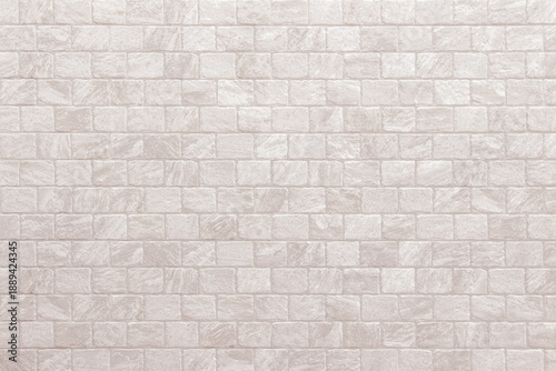 Detail of modern cream brick wall background photo. White light brick wall texture background for stone tile block painted in beige light color wallpaper modern interior and exterior backdrop design.