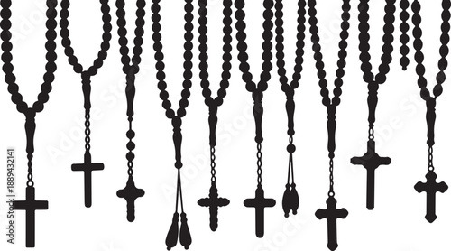 Collection of black rosaries with various crucifixes and beads displayed