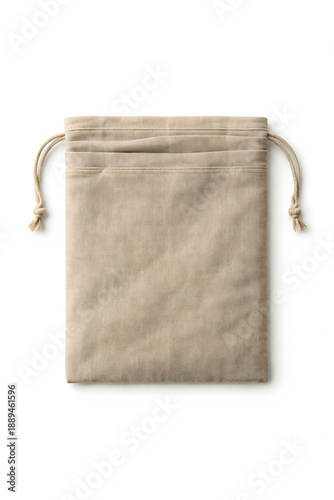 Beige cotton drawstring pouch bag mockup flat lay, eco friendly organic linen jewelry packaging and small gift storage concept isolated on white background.