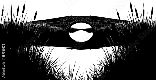 Stone arch bridge silhouette framed by pond reeds and cattails