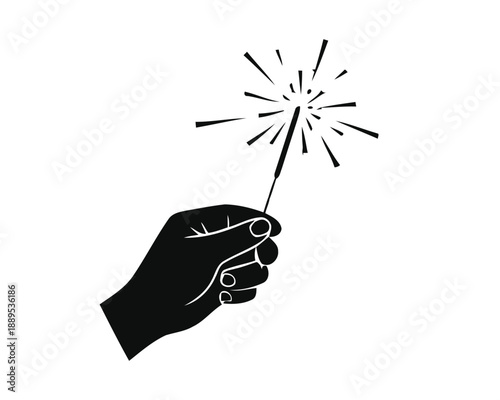 A silhouetted hand firmly holds a brightly lit sparkler, radiating a burst of festive light and joy, perfect for commemorating special moments and holiday celebrations