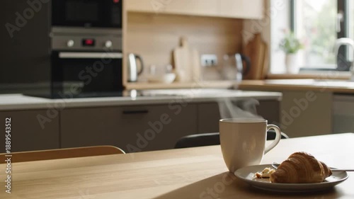 Hot Steaming Coffee Cup and Croissant on Wooden Table in Modern Kitchen