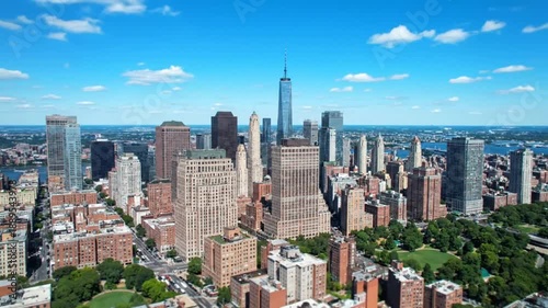 Stunning aerial footage captures the vibrant energy and iconic skyline of downtown Manhattan on a beautiful sunny day
