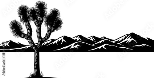 Joshua tree silhouette against a jagged mountain range horizon