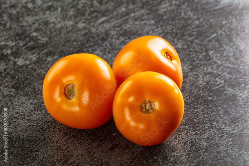 Ripe raw yellow tomato heap