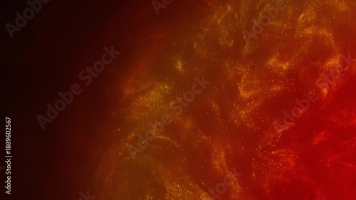 Wet shimmering. Lava art flow. Red orange sparkling particles spreading on black background. Color dust ink abstract blend blur heat water.