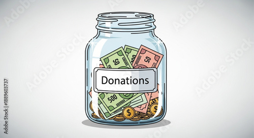 Glass jar filled with cash labeled donations for charity.