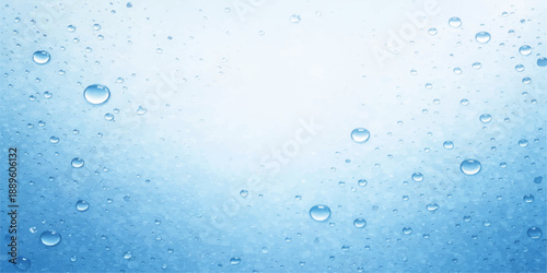Macro photography of fresh blue water drops and clear raindrops forming an abstract liquid texture of transparent condensation bubbles on a wet glass window