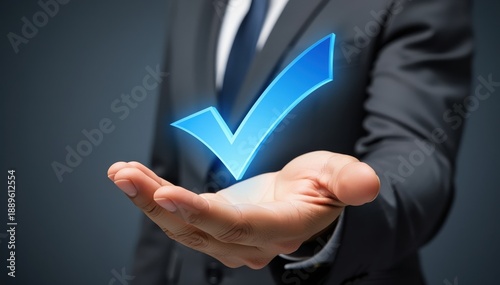 Business Approval: A hand extends, cradling a glowing checkmark, a symbol of confirmation and endorsement in a professional environment.