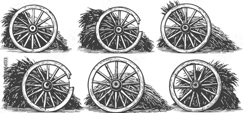 rustic wooden wagon wheels leaning against haystack bundles in vintage country set