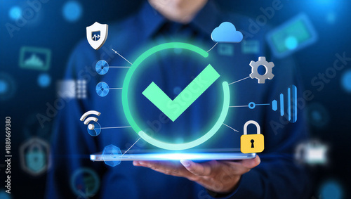 Wallpaper Mural man holding tablet with security icons and green checkmark Torontodigital.ca