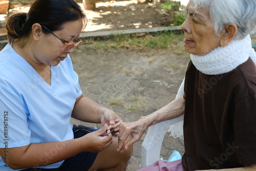 nurse helping senior woman patient