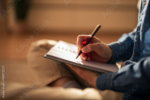 Foto Person writing in notebook for journaling