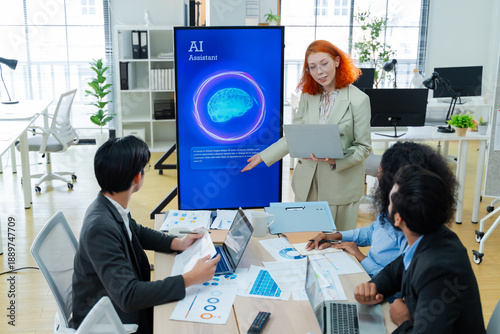 Фотография Diverse creative team use Ai Assistant (artificial intelligence assistant) on AI-assisted display for Marketing Data Analyst meeting at office