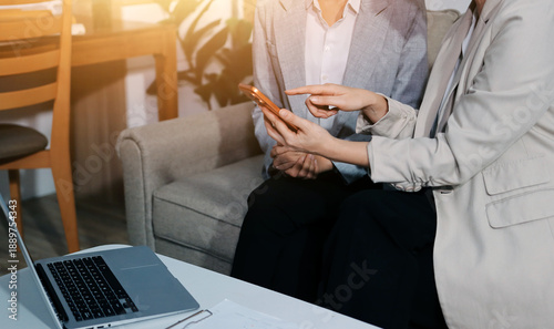 Businesswomen reviewing paperwork in conference room