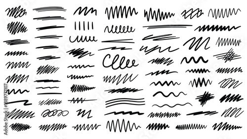Large set of various hand-drawn black ink scribbles, lines, zigzags, and strokes isolated on a white background for creative design.