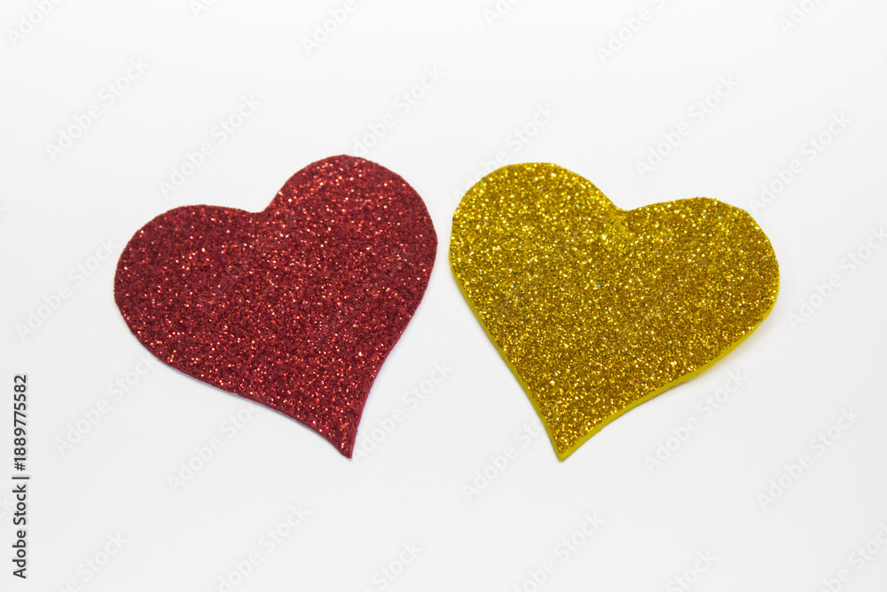 Obraz premium Pair of Glitter Hearts on White Background