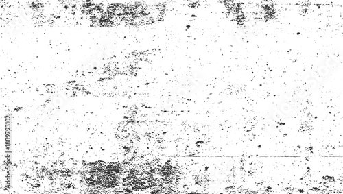 Black speckles and irregular dark patches on a white textured surface grunge background abstract