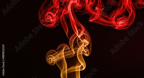 Fiery colored vapor streams upward creating intricate swirling patterns against a dark background