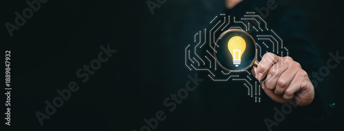 Photos Conceptual image of innovation and artificial intelligence insight represented by magnifying glass and glowing idea within digital brain