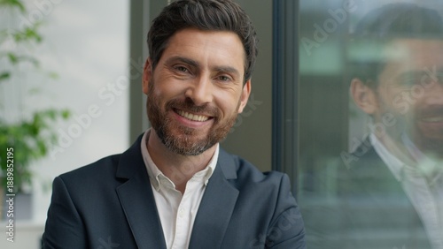 Photos Portrait happy smiling confident Caucasian middle-aged business man looking at c
