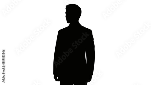 Silhouette of a man in a business suit standing alone in a professional setting viewed from the side
