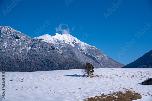 Snow-covered Buckelwiesen near Mittenwald set within the winter alpine mountains.