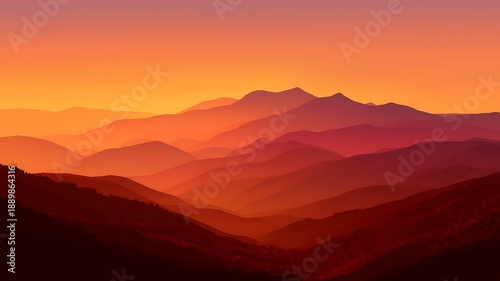 Sunset over layered mountains with vibrant orange and red hues from a distant viewpoint