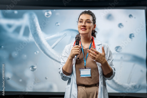 woman is giving a presentation at a conference