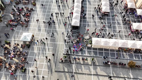 1 november 2024, Brașov, Romania. Forward drone flight, Bird view, top down view on council square during market, many people, tourists walking, around. Brasov city. Touristic must-see destination.