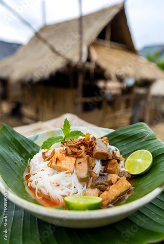 Nom Banh Chok: Fresh Rice Noodles with Fish, nom banh chok, Cambodian noodles, fish noodle dish, banana leaf serving, rural Cambodian food, fresh ingredients, Cambodian street food, traditional recipe
