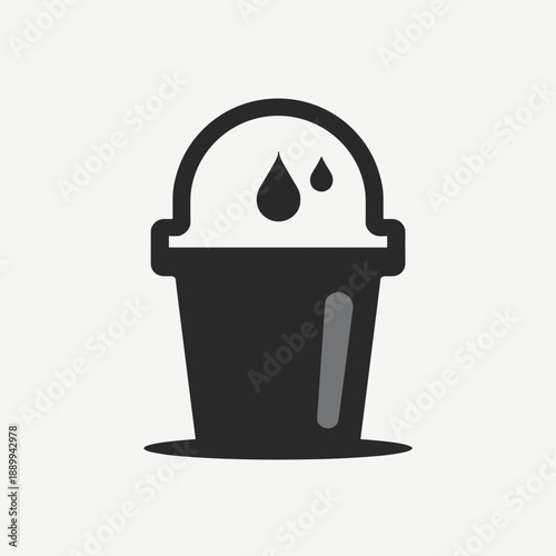 Black ice cream scoop placed in a bucket with drops of melted ice cream. Concept of summer treats, dessert indulgence, or ice cream parlors. Useful for advertising or menu design.