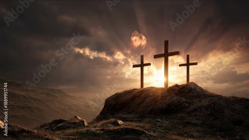 Three crosses silhouetted against a dramatic sunset sky with sunbeams breaking through clouds