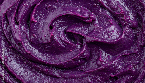 Dark purple blueberry jam or puree swirl texture macro top view
