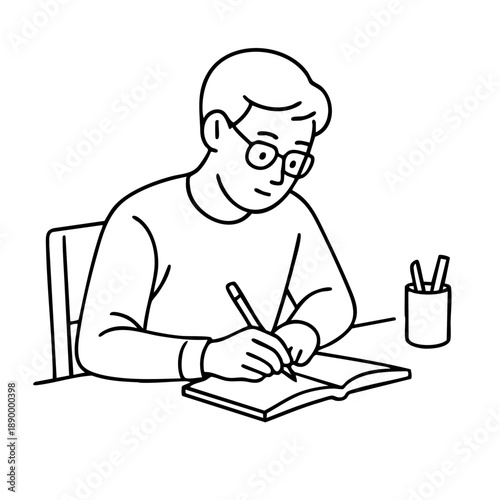 Young student with glasses writing in a notebook at a desk with a pen holder