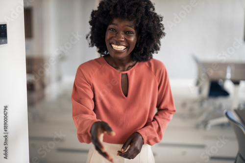 Young black woman extending hand for handshake