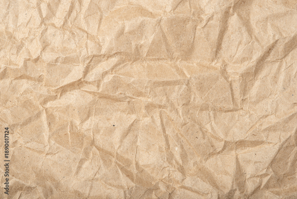 Fototapeta premium The texture of crumpled craft paper